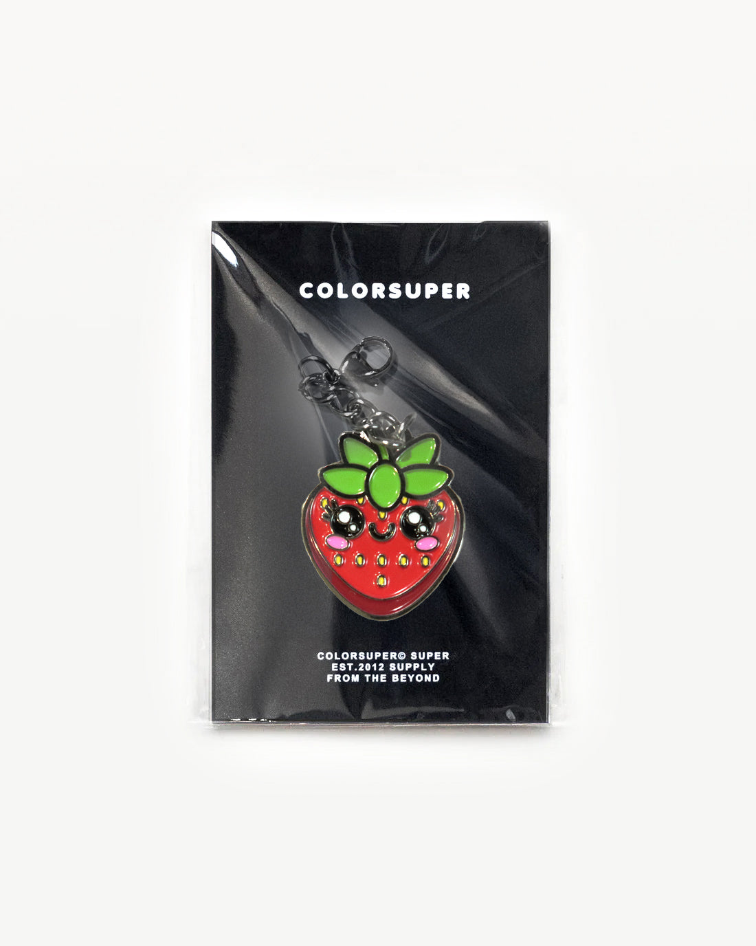 Juicy Fruit Strawberry charm by Colorsuper, shiny red with cute face and green leaves on a display card. - Alternate view