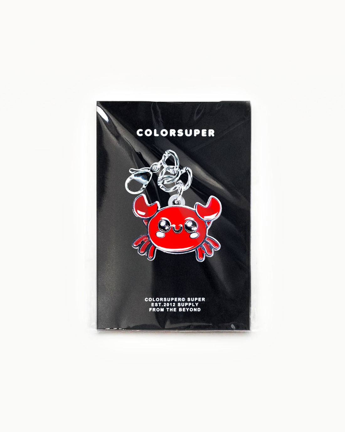 Bikini Charm - Crabby Charm featuring a cute red crab accessory on a stylish black packaging. - Alternate view
