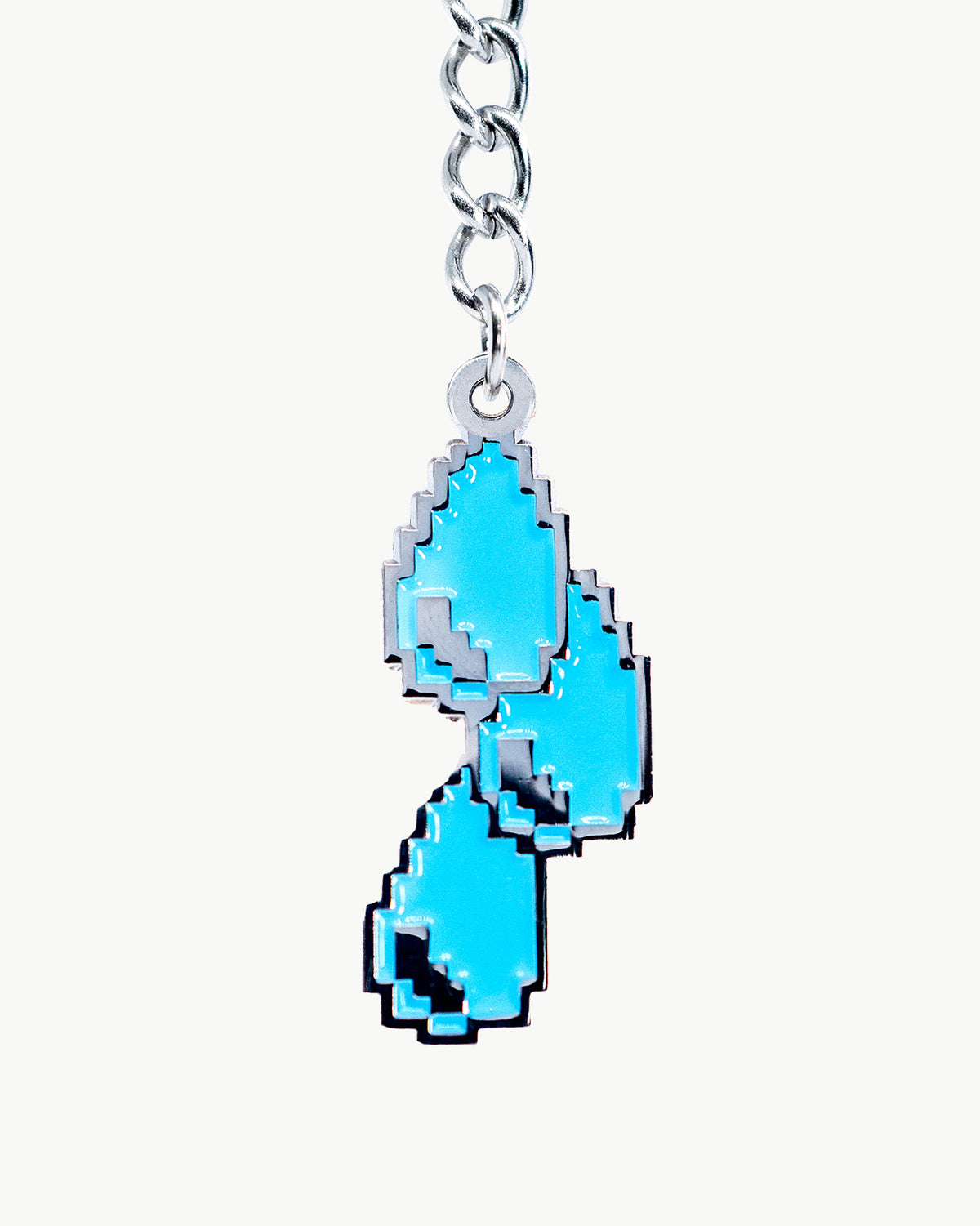 Drippy blue bikini charm accessory, perfect for summer outfits and playful jewelry collections.
