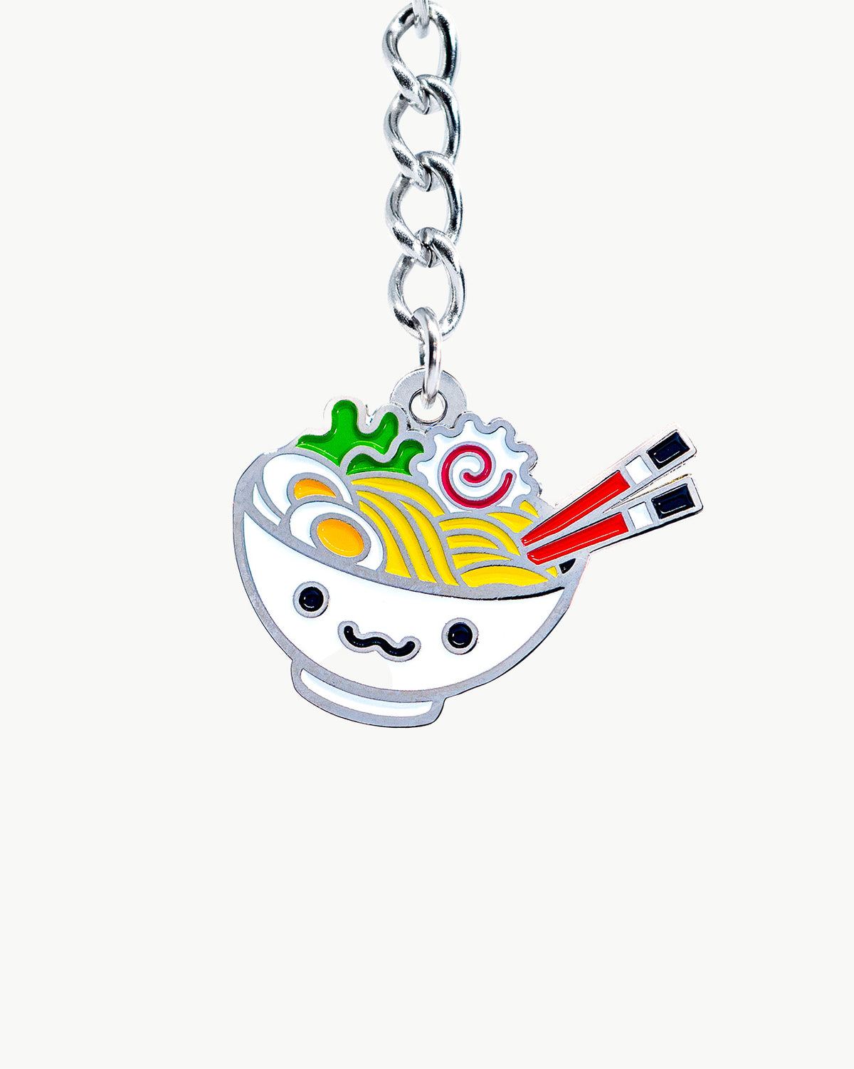 Kawaii ramen bowl charm with face, colorful details, and chopsticks, perfect for accessories and collectors.