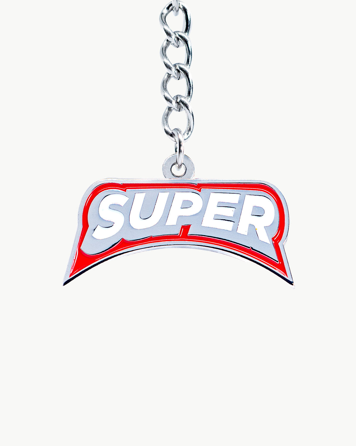 Bold 'SUPER' charm with red and silver design on a metallic clip, showcasing big logo energy and style.