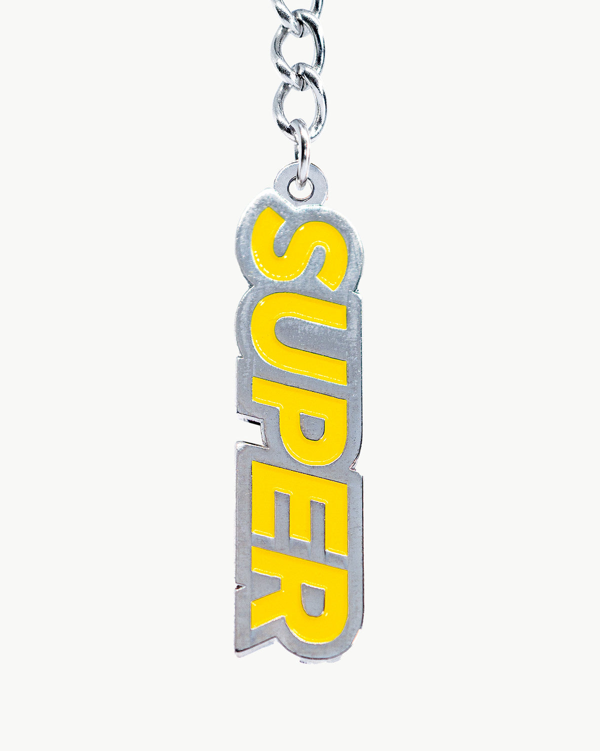 Sunny super yellow bikini charm with bold 'SUPER' lettering, perfect for vibrant summer swimwear accessories.