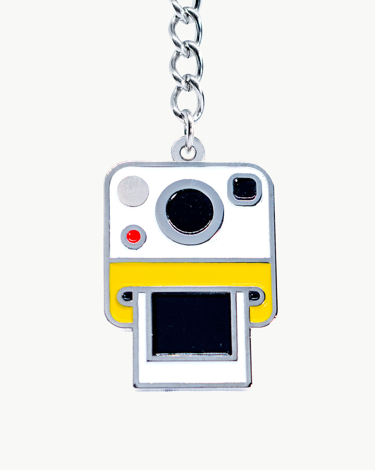 Vintage Polaroid camera bikini charm, perfect for summer photoshoots and trendy retro swimwear accessories.
