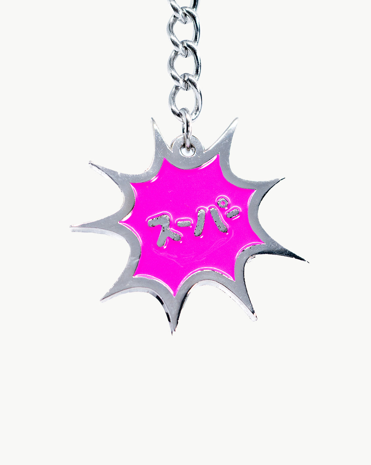 Vibrant pink comic book 'Super' charm for swim accessories, eye-catching and fun design.