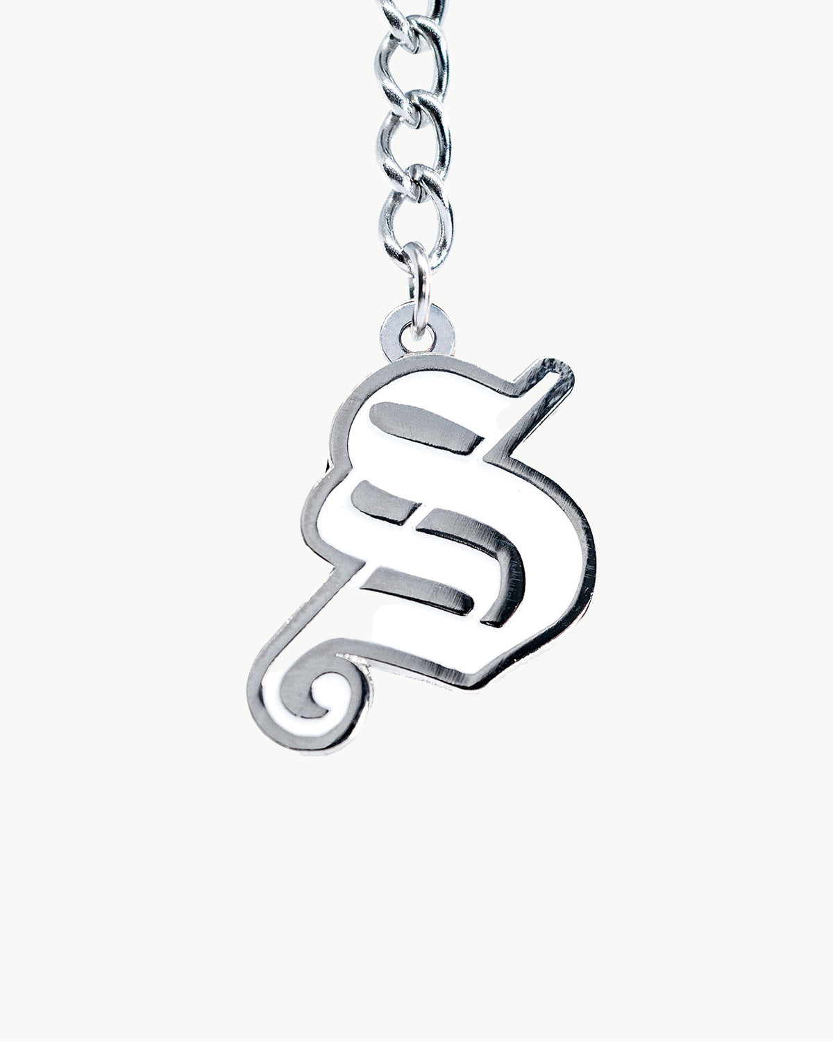 Gothic S charm in chrome, showcasing a bold modern design, perfect for stylish accessory lovers.