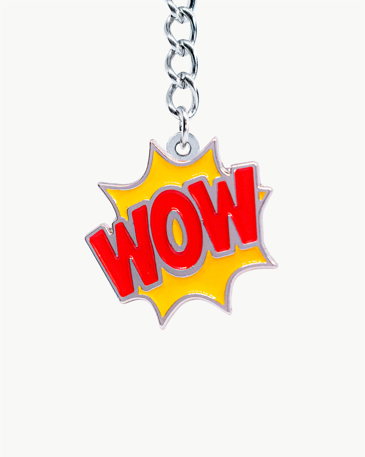 Bikini Charm - Wow (Red) Charm featuring a vibrant comic-book WOW explosion in red and yellow enamel.