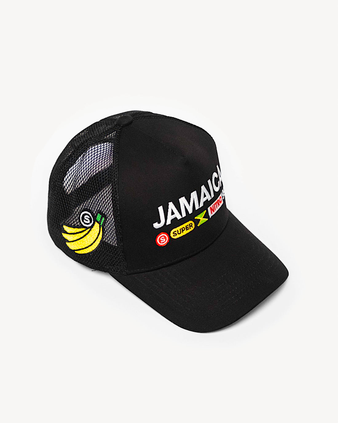 Side view of a stylish black snapback hat showcasing side patchwork, with intricate Jamaica-inspired patches on the front and a cooling mesh rear design. - Alternate view