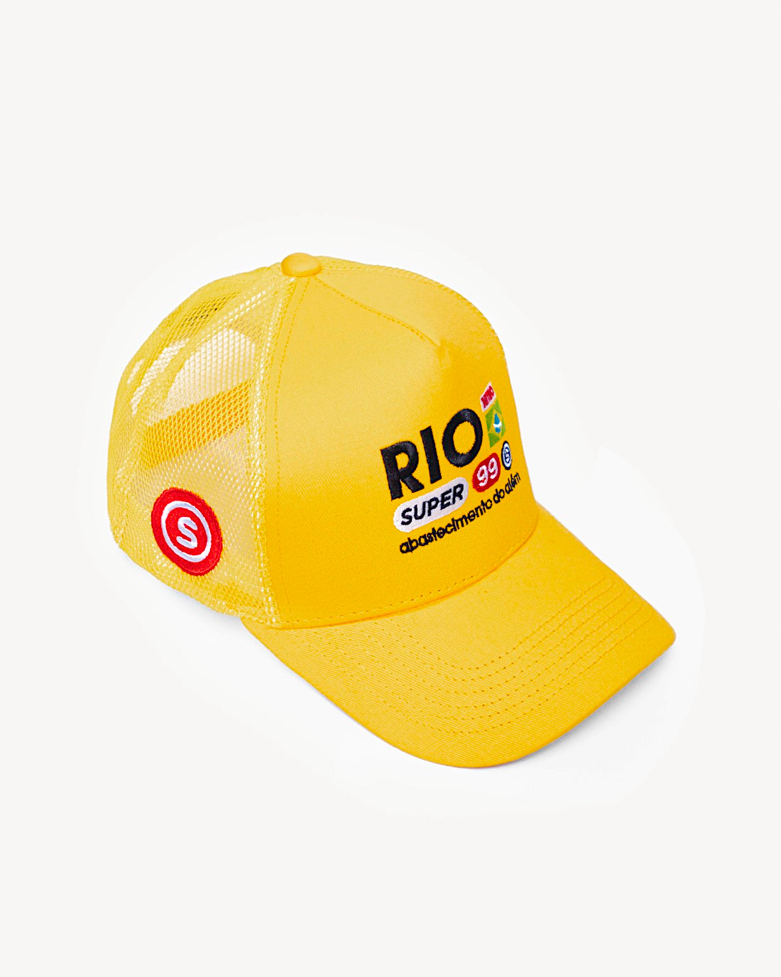Side view of a vibrant yellow snapback hat showcasing side patch design, with designer Brazilian-inspired patches on the front and a cooling mesh rear design. - Alternate view