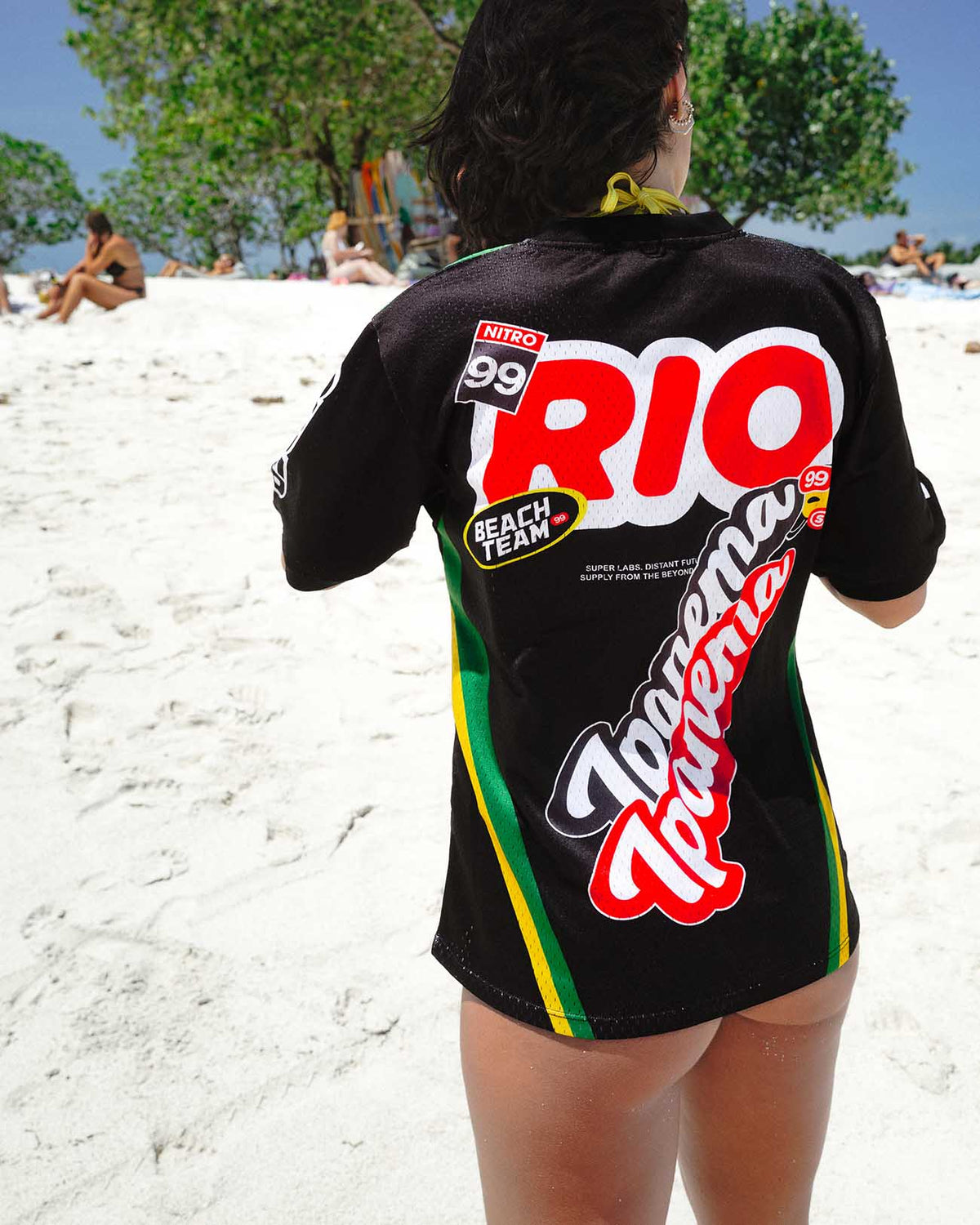 Ipanema Black Jersey worn at the beach, showcasing unique graphics and vibrant colors for a casual summer style. - Alternate view