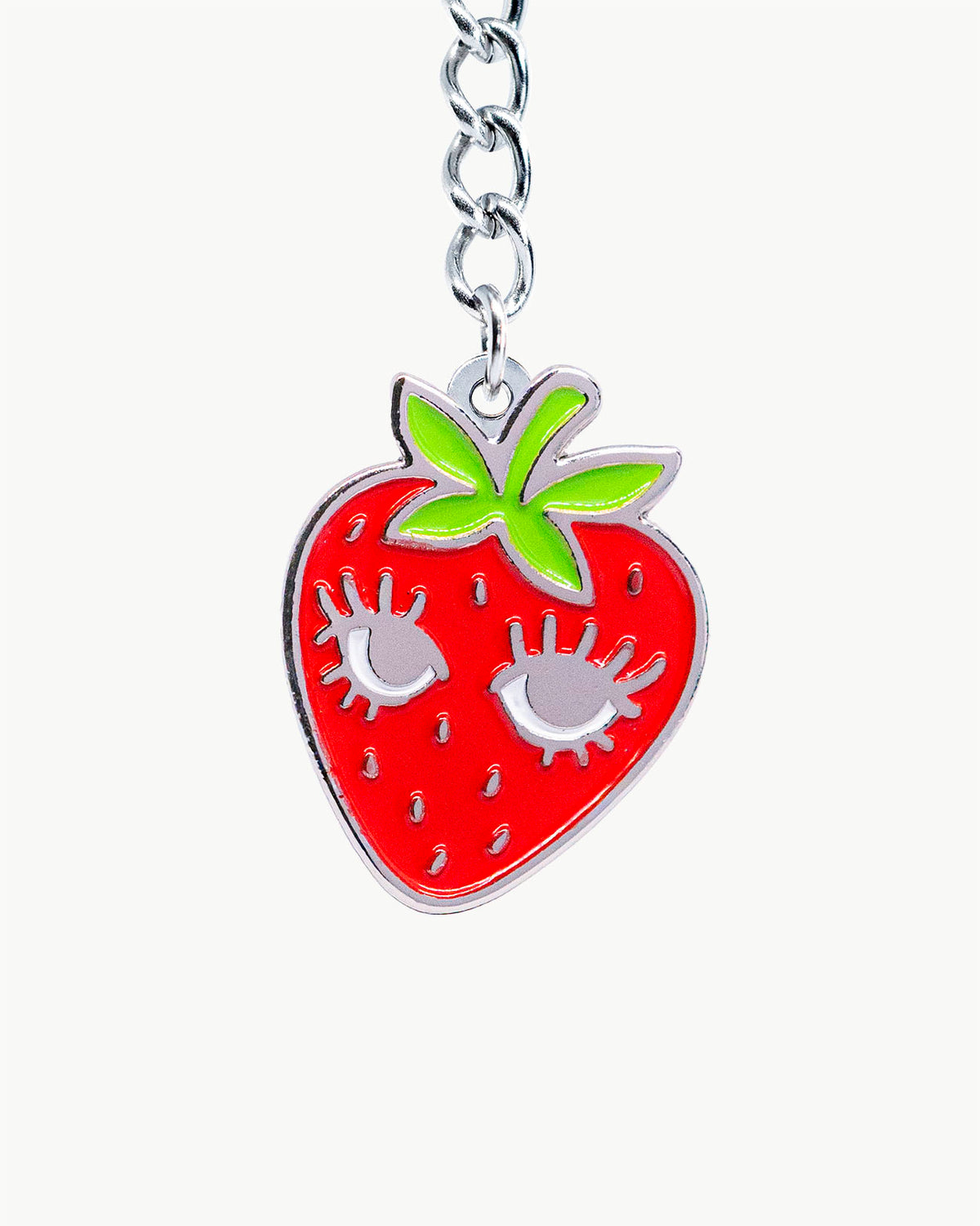 Bikini Charm - Berry Charm featuring a playful strawberry design with fluttering eyelashes in vibrant colors.