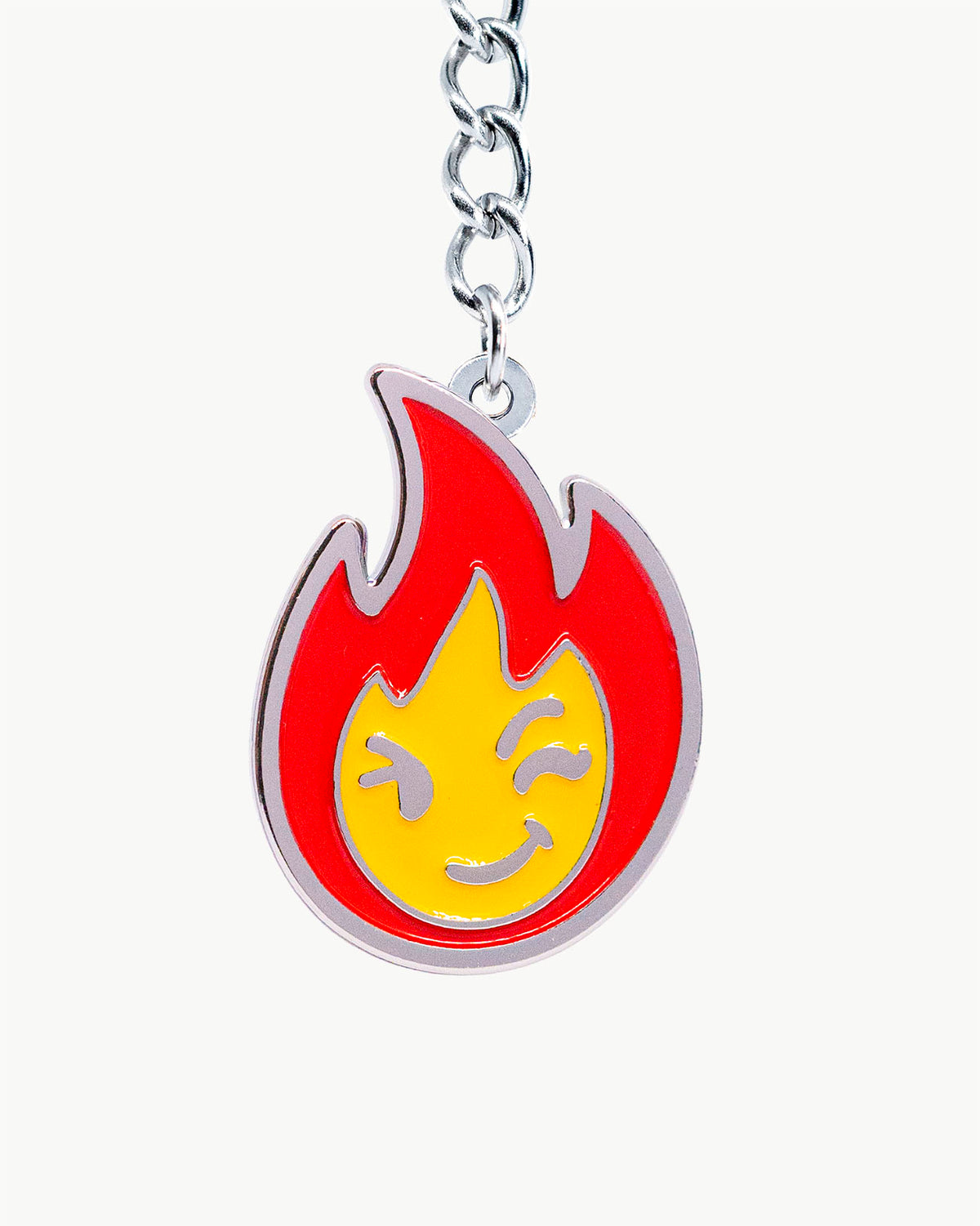 Bikini Charm - Burner Charm featuring a vibrant red and yellow flame with a playful smiling face.