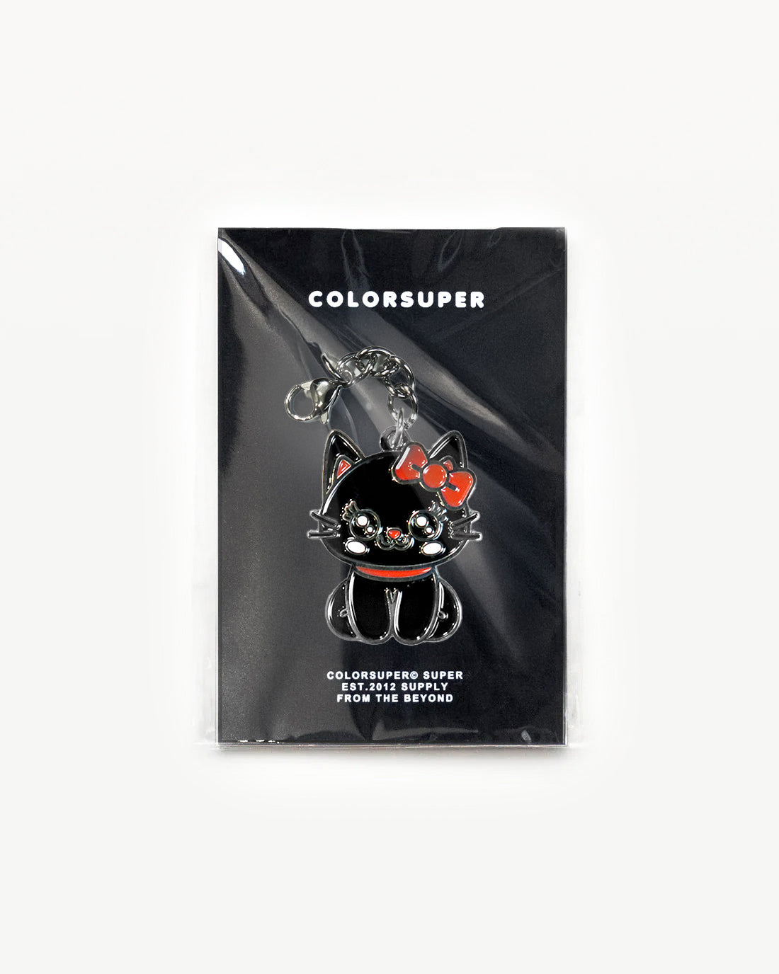 Cute black cat charm with red bow in packaging, radiating cool-cat vibes and sparkle. - Alternate view