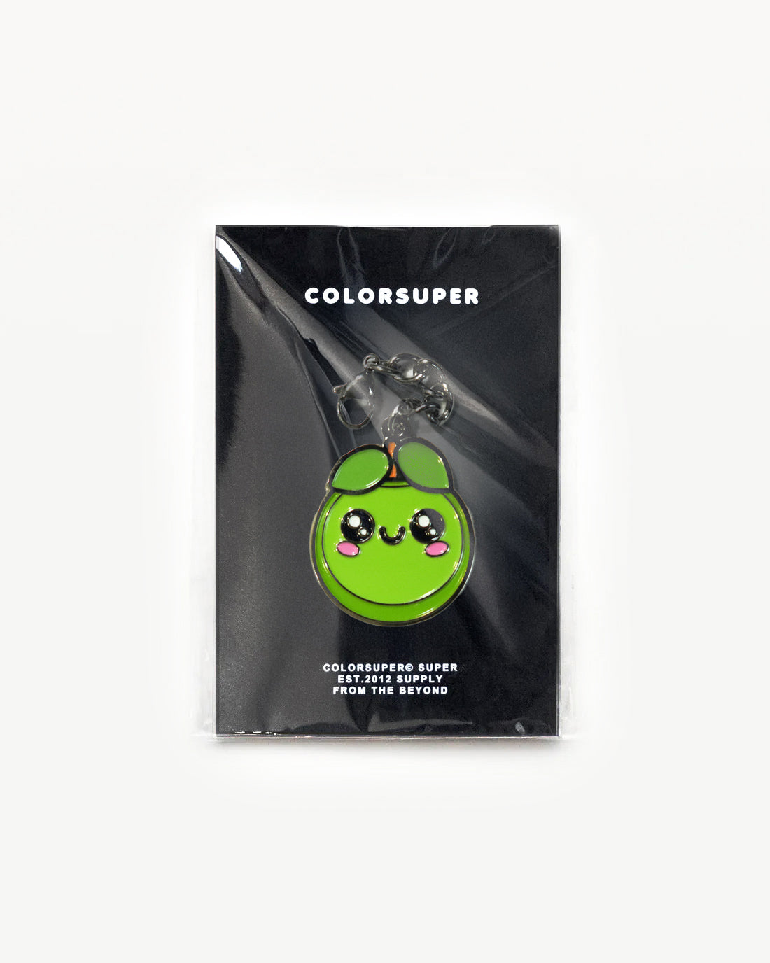 Cute green fruit charm with smiling face, packaged and ready for fun fashion accessories. - Alternate view