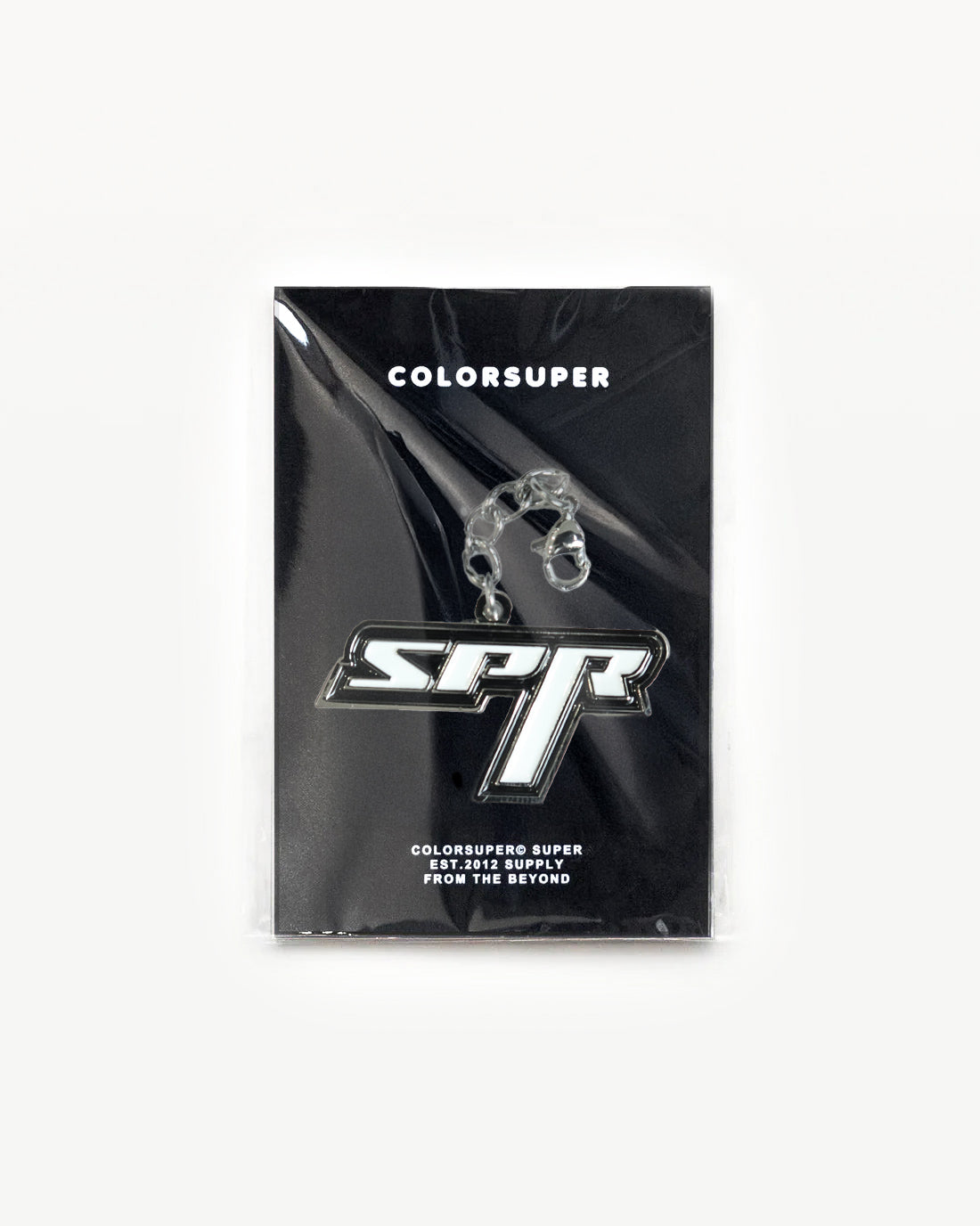 Bikini Charm SPR Black displayed in sleek packaging, showcasing its bold shape and clean lines. - Alternate view