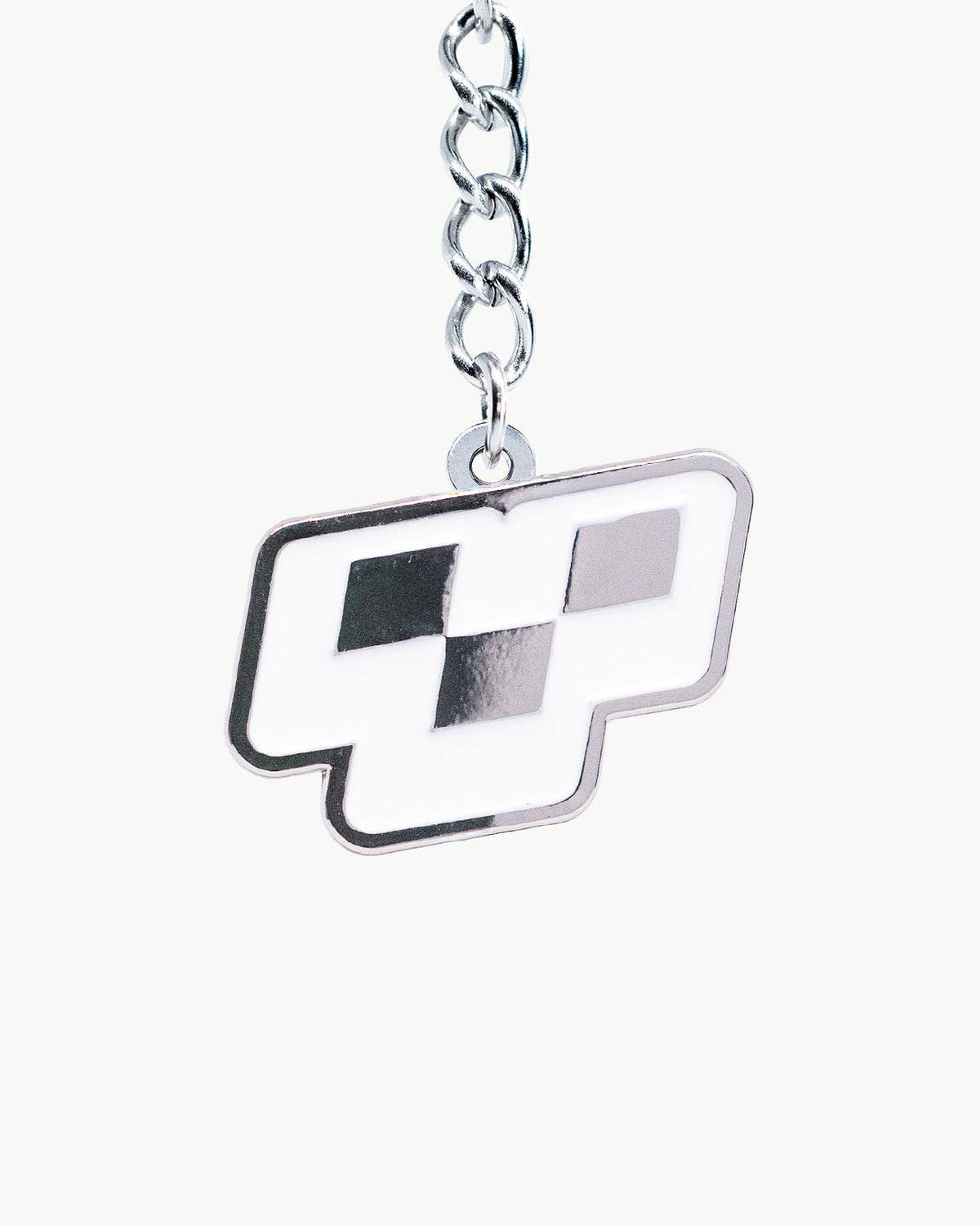 Bikini Charm - Motif (Chrome) Charm featuring a geometric emblem in polished silver and white finish.