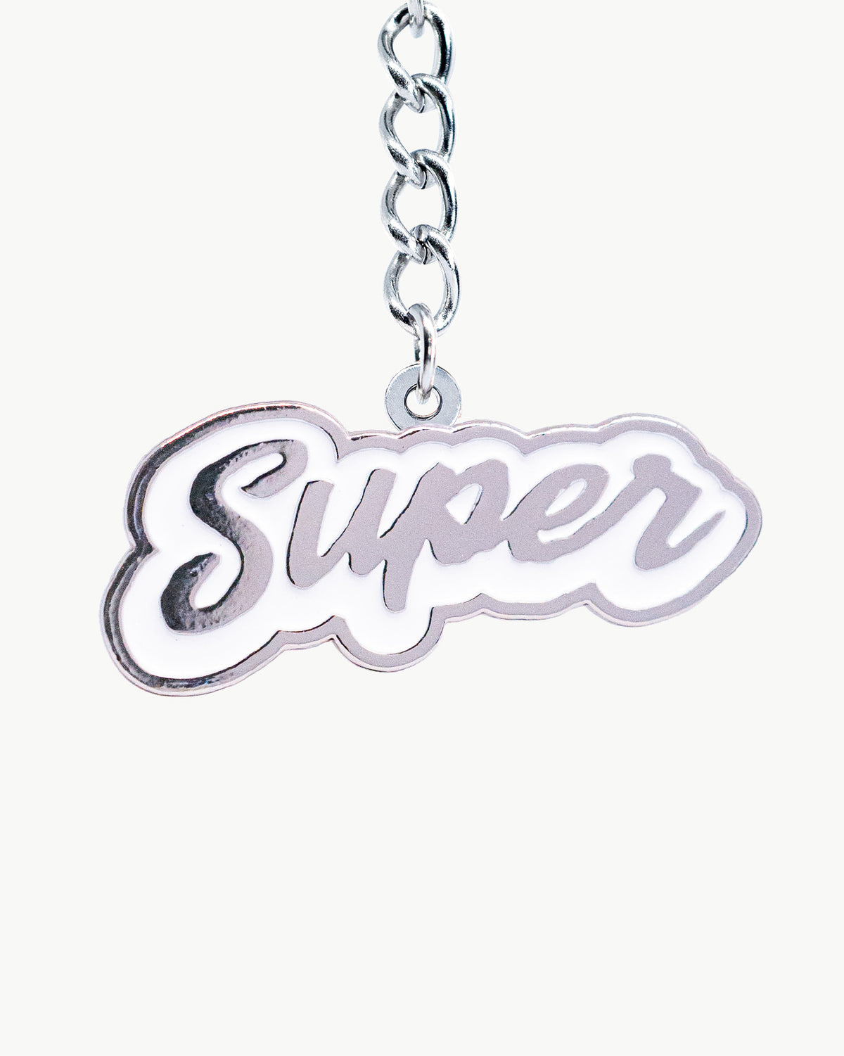 Bikini Charm - Wipeout (Chrome) Charm featuring a sleek silver-toned 'Super' script pendant.