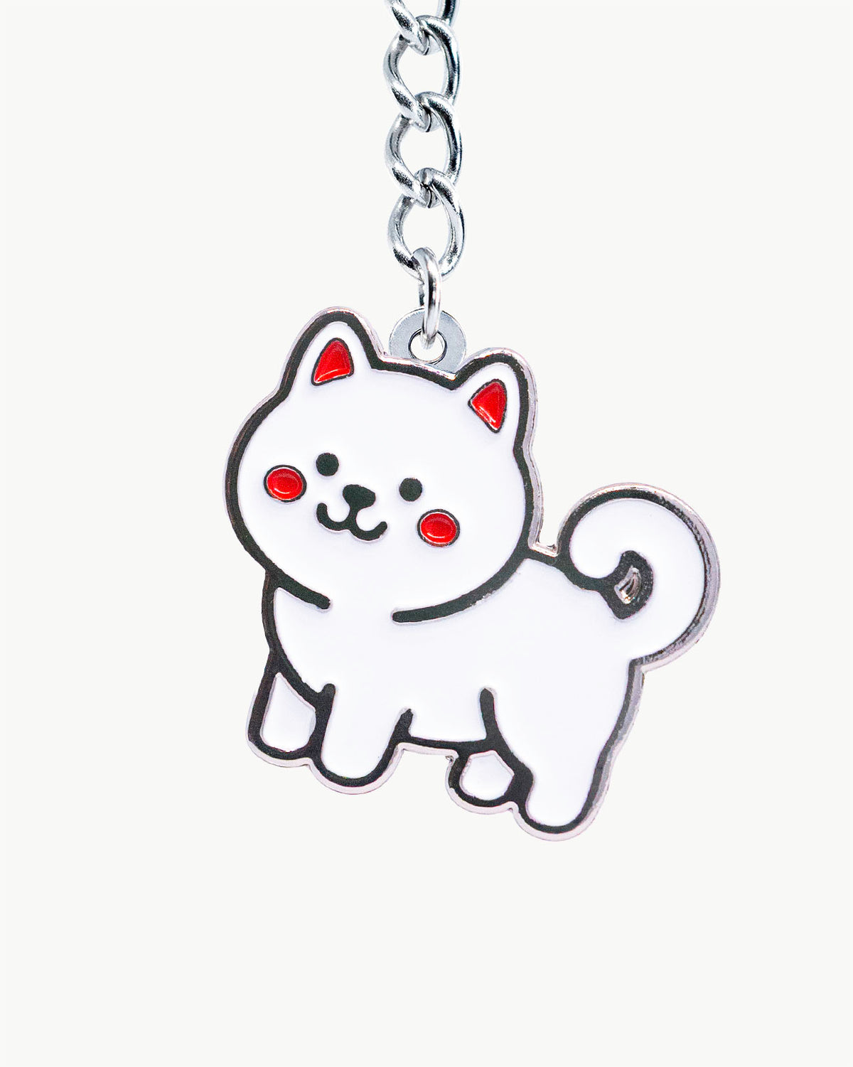 Bikini Charm - Shiro Snow Charm, cute white dog enamel accessory with red cheeks on a keychain.