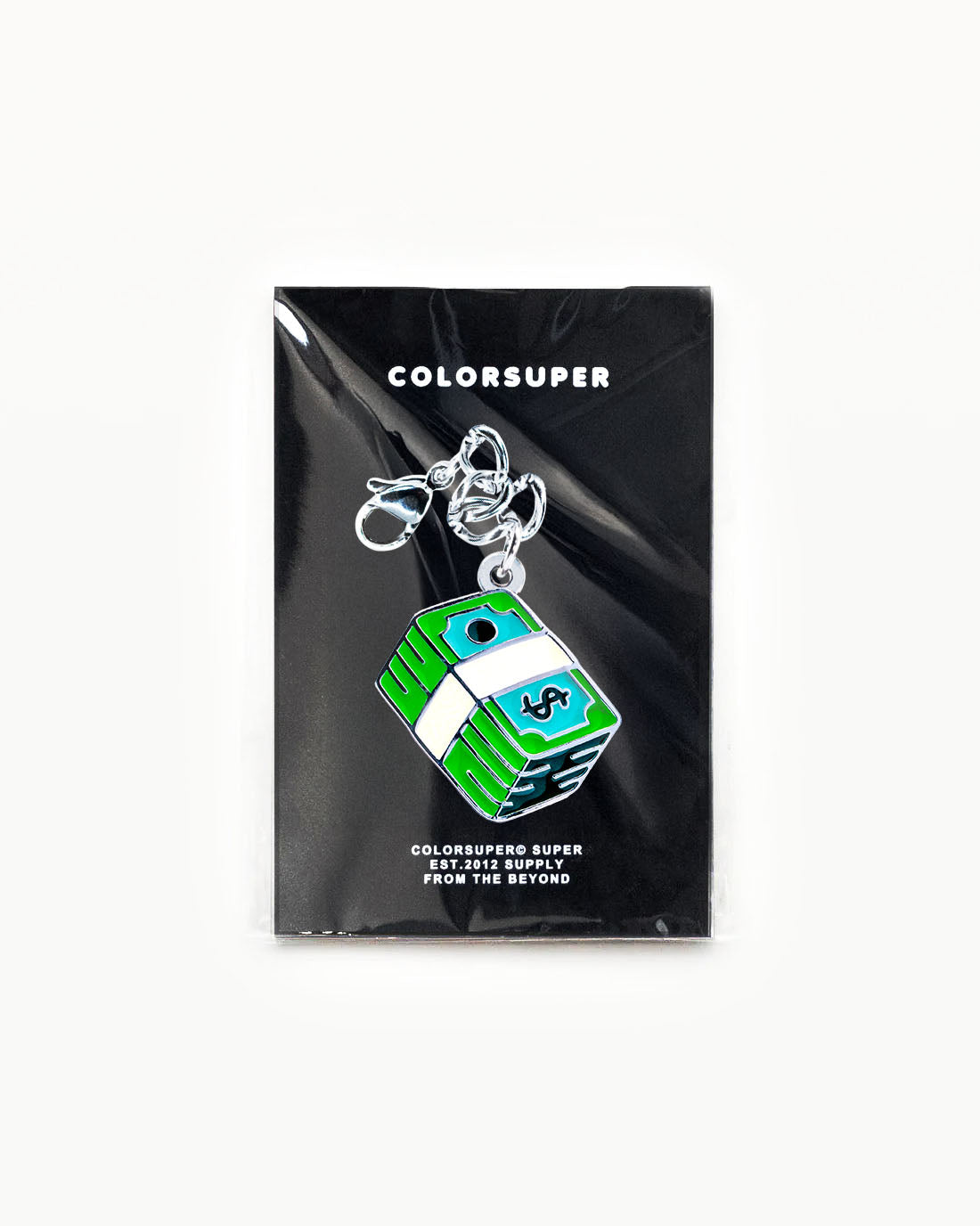 Bikini Charm - Brick Charm on packaged display, featuring a playful design with a stack of cash and vibrant colors. - Alternate view