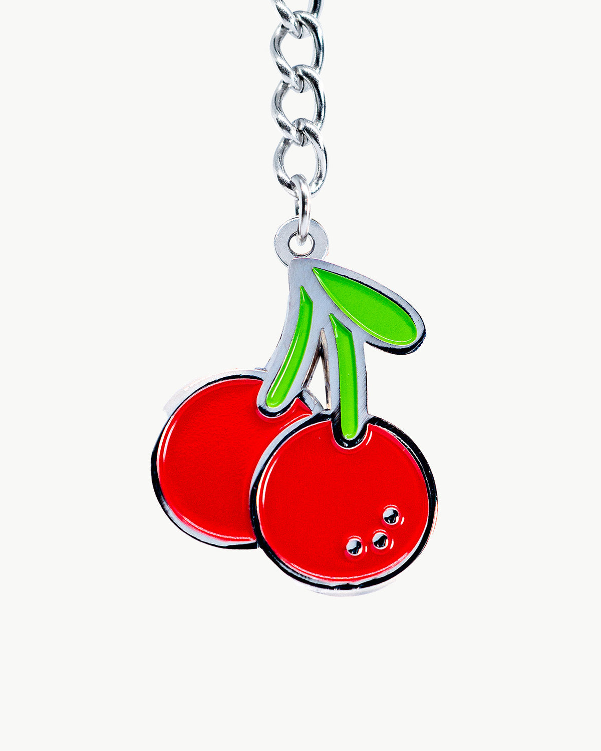 Luscious red cherry bikini charm on a silver chain, perfect for adding flair to swimwear and beach accessories.