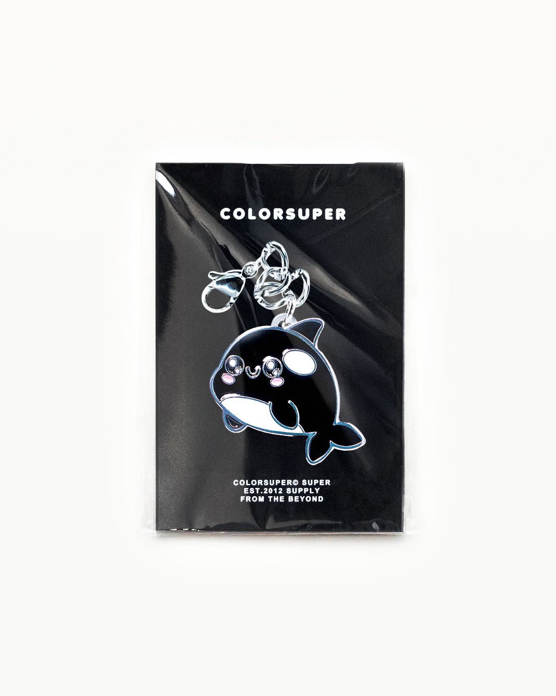 Bikini Charm - Cute Killer Charm featuring a kawaii orca keychain on a black packaging. - Alternate view
