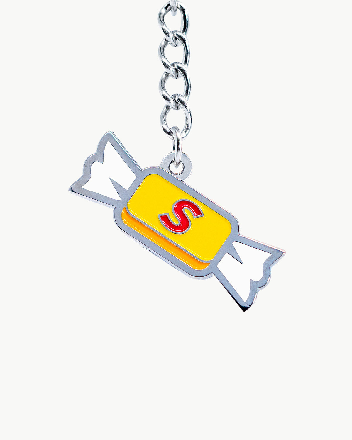 Bright yellow candy charm with a silver chain, adding a nostalgic pop of color to your collection.