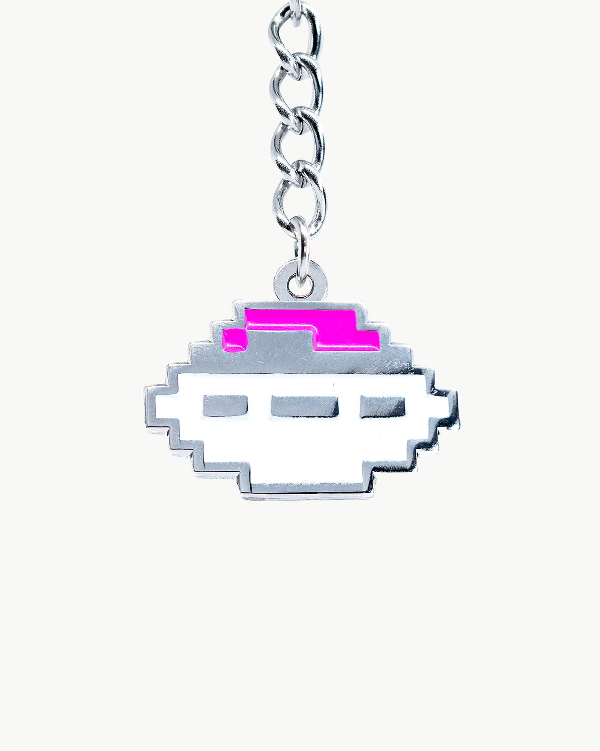 Silver UFO charm with pink accents, perfect for adding a futuristic touch to swimwear accessories.