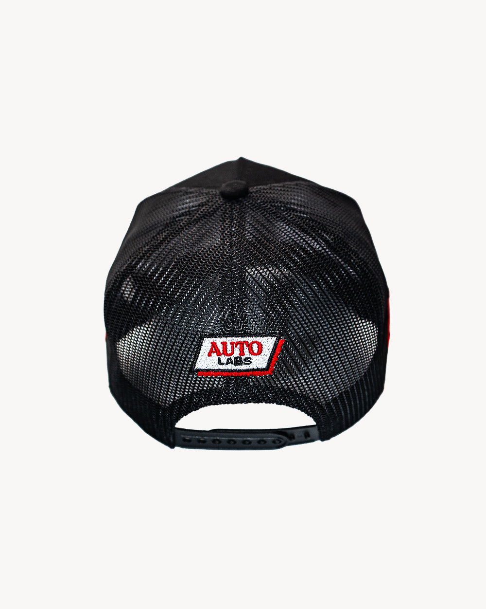 Vamp Snapback Black cap featuring a mesh back design with detailed embroidered logo at the rear for comfort and style.